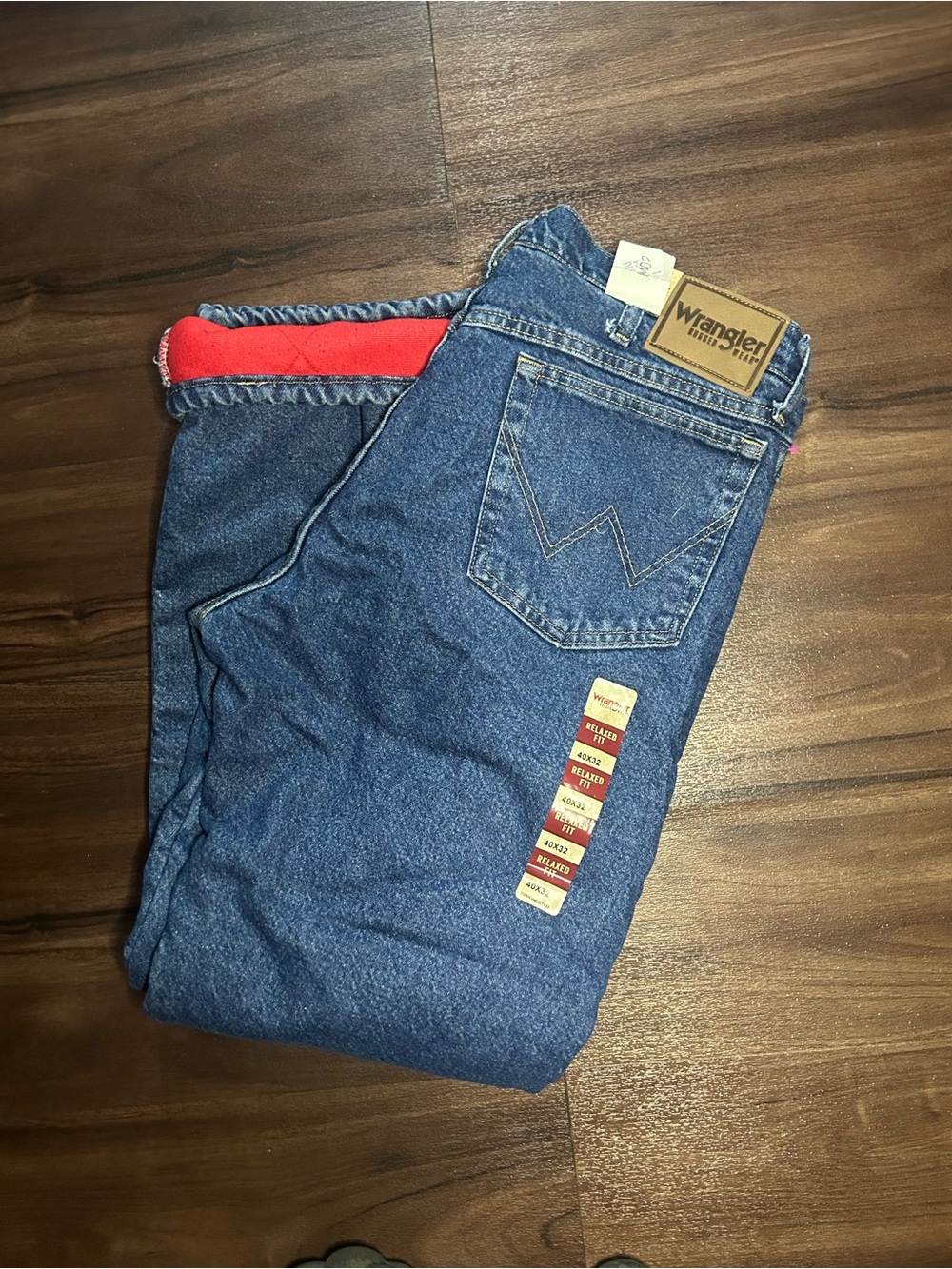 Wrangler Men's Relaxed Blue Denim Jeans with Red Waistband Accent